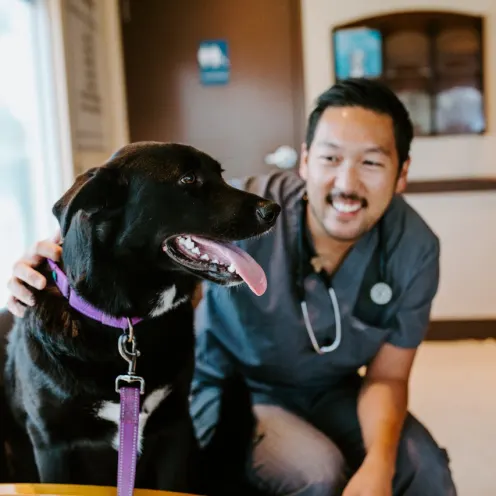 Dr. Lee and dog at Overland Veterinary Clinic